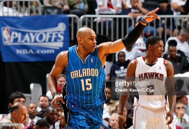 Vince Carter of the Orlando Magic reacts after a three-point basket against Joe Johnson of the Atlanta Hawks during Game Four of the Eastern...