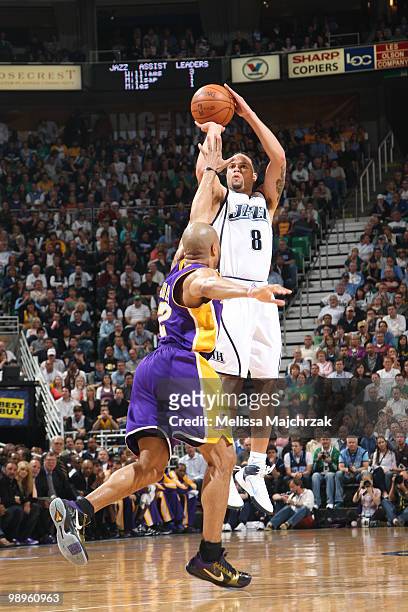 Deron Williams of the Utah Jazz shoots the ball over Derek Fisher of the Los Angeles Lakers in Game Four of the Western Conference Semifinals during...
