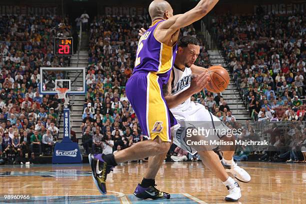 Deron Williams of the Utah Jazz drives against Derek Fisher of the Los Angeles Lakers in Game Four of the Western Conference Semifinals during the...