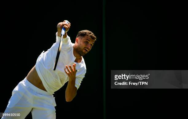 Grigor Dimitrov of Bulgaria practices before the Championships at the All England Lawn Tennis and Croquet Club in Wimbledon on June 30, 2018 in...