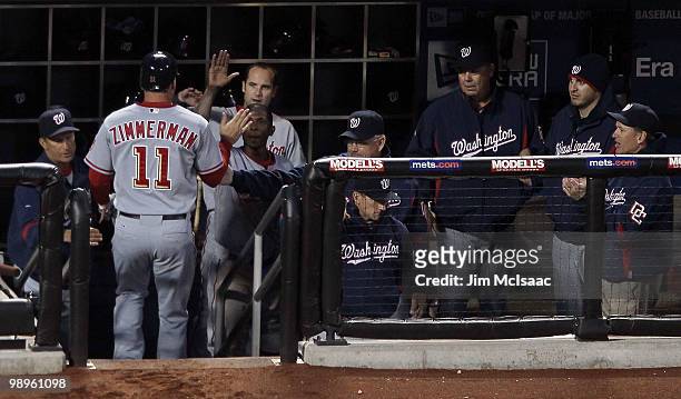 Ryan Zimmerman of the Washington Nationals is congratulated after his third inning home run against the New York Mets on May 10, 2010 at Citi Field...