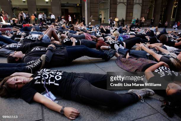 Members of the Make Poverty History campaign perform a musical flash mob at Martin Place on May 11, 2010 in Sydney, Australia. The performance aimed...