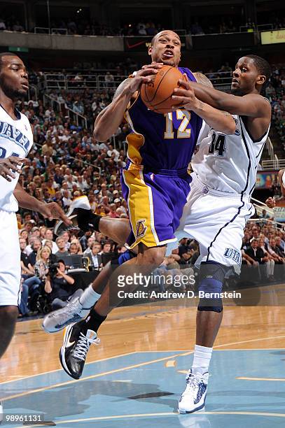 Shannon Brown of the Los Angeles Lakers goes hard to the hoop against C.J. Miles of the Utah Jazz in Game Four of the Western Conference Semifinals...