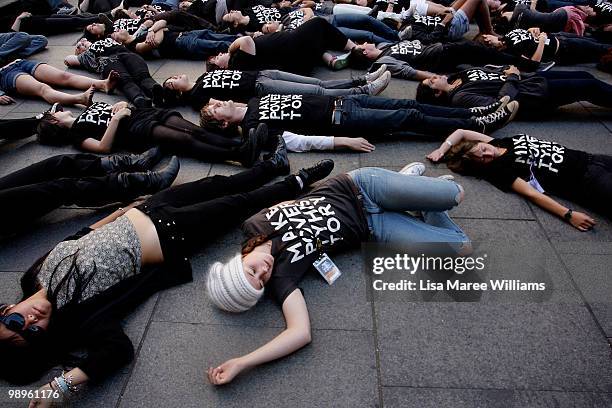 Members of the Make Poverty History campaign perform a musical flash mob at Martin Place on May 11, 2010 in Sydney, Australia. The performance aimed...