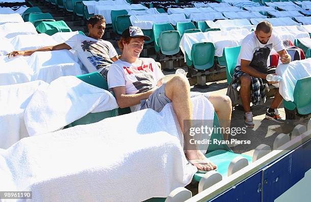 Lewis Jetta, Gary Rohan and Rhyce Shaw of the Swans look on from the stands during a Sydney Swans training session at the Sydney Cricket Ground on...