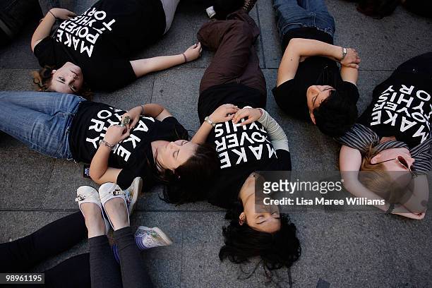 Members of the Make Poverty History campaign perform a musical flash mob at Martin Place on May 11, 2010 in Sydney, Australia. The performance aimed...