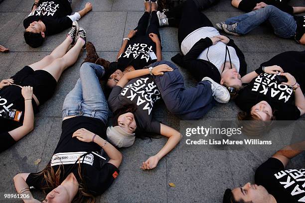 Members of the Make Poverty History campaign perform a musical flash mob at Martin Place on May 11, 2010 in Sydney, Australia. The performance aimed...