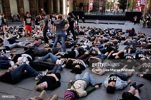 Members of the Make Poverty History campaign perform a musical flash mob at Martin Place on May 11, 2010 in Sydney, Australia. The performance aimed...