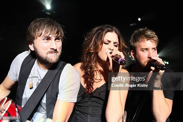 Dave Haywood, Hillary Scott and Charles Kelley of Lady Antebellum perform onstage at Nokia Theatre on May 10, 2010 in New York City.