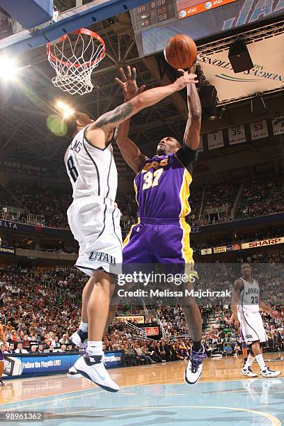 Deron Williams of the Utah Jazz defends against Ron Artest of the Los Angeles Lakers in Game Four of the Western Conference Semifinals during the...