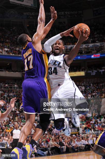 Miles of the Utah Jazz goes to he hoop against Andrew Bynum of the Los Angeles Lakers in Game Four of the Western Conference Semifinals during the...
