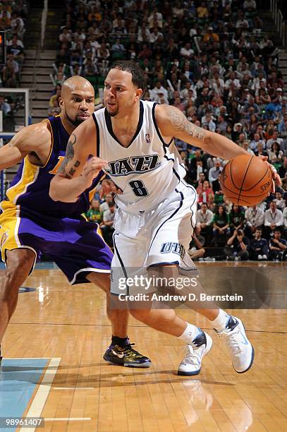 Deron Williams of the Utah Jazz drives past Derek Fisher of the Los Angeles Lakers in Game Four of the Western Conference Semifinals during the 2010...