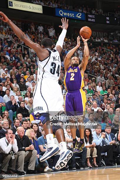 Miles of the Utah Jazz contests the shot of Derek Fisher of the Los Angeles Lakers in Game Four of the Western Conference Semifinals during the 2010...