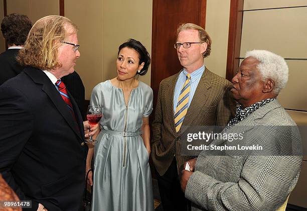 Photographer Peter Turnley, TV personality/journalist Ann Curry, photographer David Turnley, and photographer Peter Magubane attend the 26th annual...