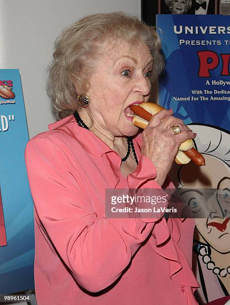Betty White unveils the "Naked" hot dog at Pink's Hot Dogs at Universal CityWalk on April 19, 2010 in Universal City, California.