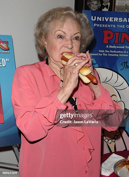 Betty White unveils the "Naked" hot dog at Pink's Hot Dogs at Universal CityWalk on April 19, 2010 in Universal City, California.