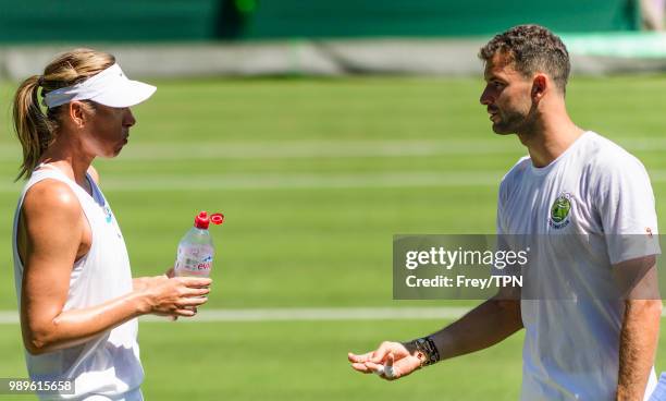 Grigor Dimitrov of Bulgaria talks to ex-girlfriend Maria Sharapova of Russia during practice before the start of the Championships at the All England...