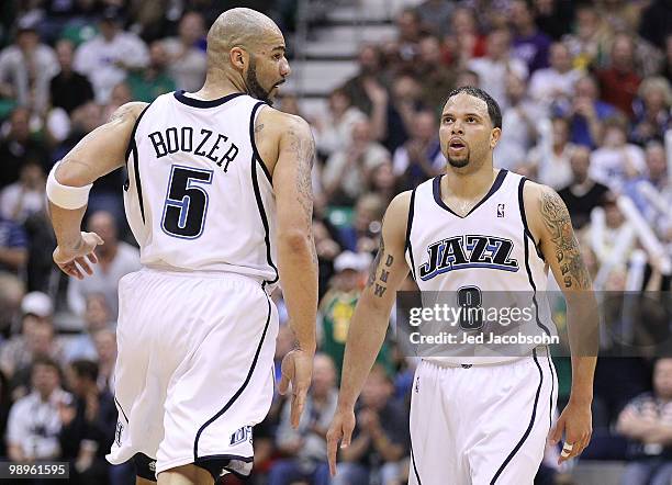 Deron Williams and Carlos Boozer of the Utah Jazz look on against the Los Angeles Lakers during Game Four of the Western Conference Semifinals of the...