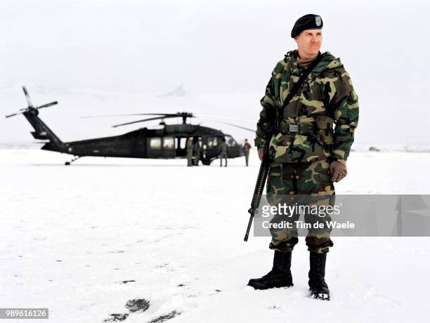 Winter Olympic Games : Salt Lake City, 2/18/02, Utah, United States --- A National Guard Watches Over A Black Hawk Helicopter At An Undisclosed...