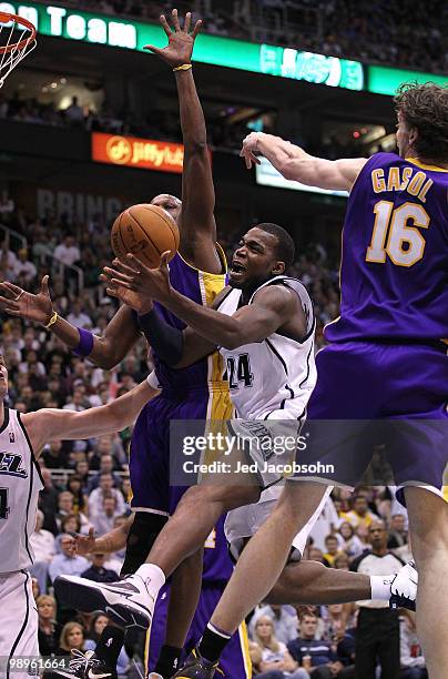 Paul Millsap of the Utah Jazz shoots against Pau Gasol and Lamar Odom of the Los Angeles Lakers during Game Four of the Western Conference Semifinals...