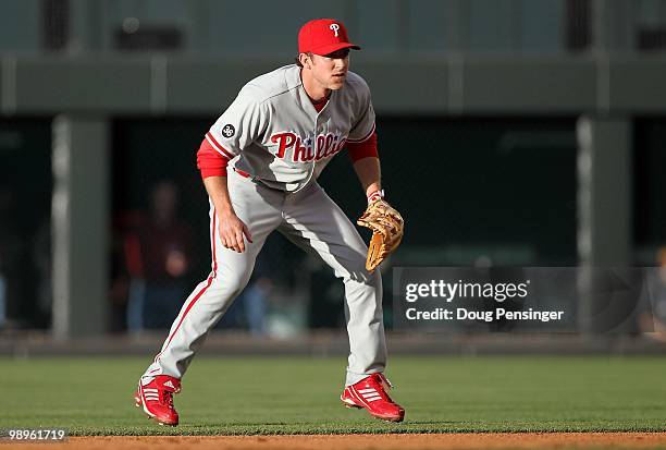 Second baseman Chase Utley of the Philadelphia Phillies plays defense against the Colorado Rockies at Coors Field on May 10, 2010 in Denver,...