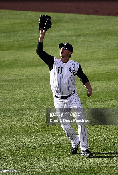 Rightfielder Brad Hawpe of the Colorado Rockies catches a fly ball against the Philadelphia Phillies at Coors Field on May 10, 2010 in Denver,...