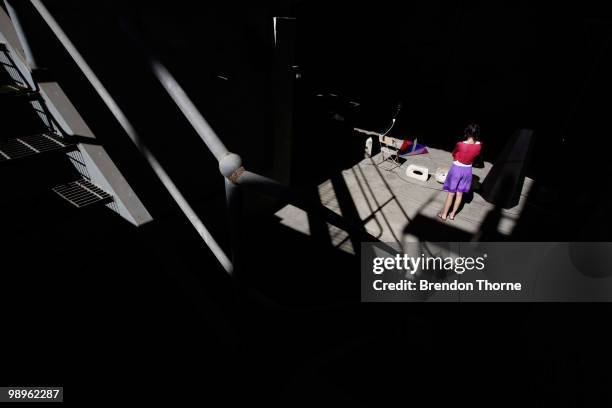 Woman admires artist Mikala Dwyer's sculpture "Outfield" during a media preview of the 17th Biennale of Sydney at Cockatoo Island on May 11, 2010 in...