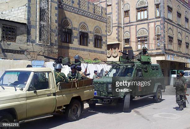 Yemeni security forces guard the area around Sanaa's penal court during a hearing in the case of an arrested arms dealer on May 11, 2010. Tribal...