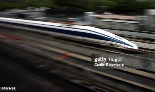 Magnetic-levitation train passes at Central Japan Railway Co.'s Yamanashi Maglev test line in Tsuru City, Yamanashi Prefecture, Japan, on Tuesday,...