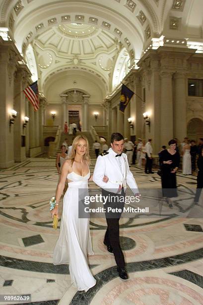 Midshipman Robert Madel escorts Estee Lauder Spokes model Carolyn Murphy to the Ring Dance.