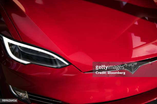 The headlight of a Tesla Inc. Model S P100D sedan vehicle is seen at the company's new showroom in New York, U.S., on Thursday, Dec. 14, 2017. For...