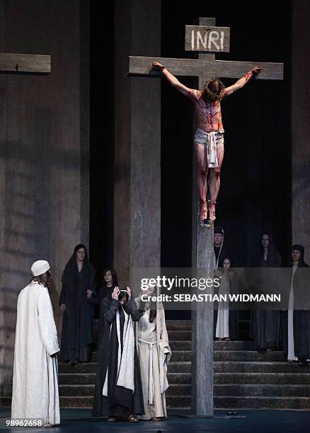 Frederik Mayet in the role of Jesus, Andrea Hecht as Maria and Eva-Maria Reiser as Maria Magdalena perform during a dress rehearsal at Oberammergau's...
