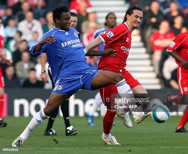 Middlesbrough Tuncay Sanli tackles Chelsea's Mikel John Obi during a Premiership football match at the Riverside stadium in Middlesbrough, north east...