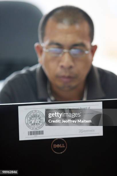 An election officer is seen at the provincial capitol of Maguindanao as vote counting continues to try to determine the next President of the...