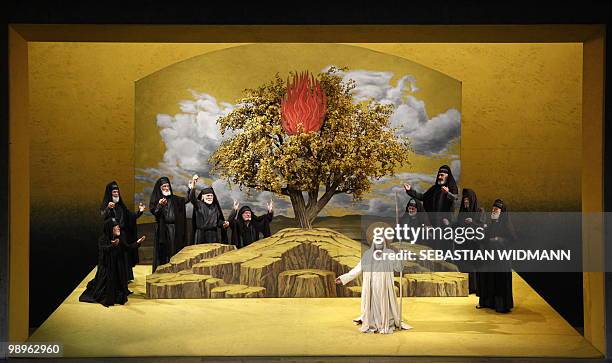 Residents of the small Bavarian village of Oberammergau perform during a dress rehearsal at Oberammergau's Passion Play theatre on May 10, 2010. The...