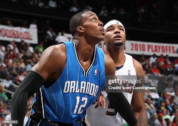 Dwight Howard of the Orlando Magic boxes out against Josh Smith of the Atlanta Hawks in Game Four of the Eastern Conference Semifinals during the...