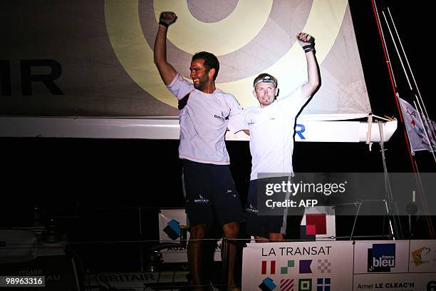 French skippers Armel Le Cleac'h and Fabien Delahaye celebrate on their "Brit Air" monohull after winning the AG2R La Mondiale sailing race between...