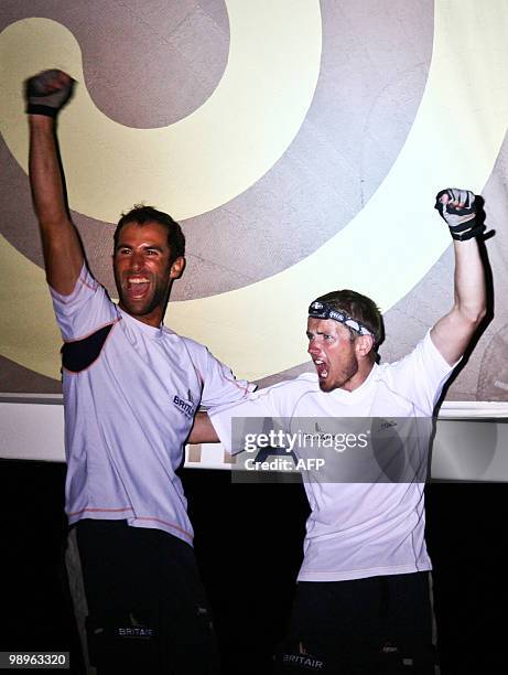 French skippers Armel Le Cleac'h and Fabien Delahaye celebrate on their "Brit Air" monohull after winning the AG2R La Mondiale sailing race between...