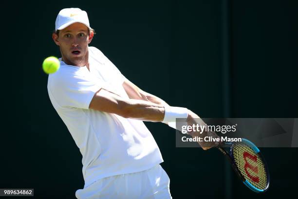 Nicolas Jarry of Chile returns toFilip Krajinovic of Serbia during their Men's Singles first round match on day one of the Wimbledon Lawn Tennis...