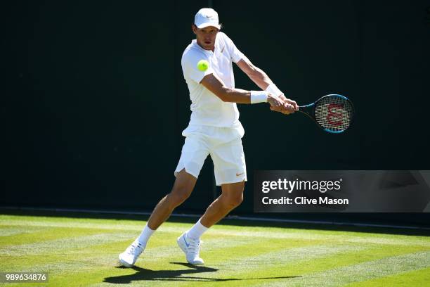 Nicolas Jarry of Chile returns toFilip Krajinovic of Serbia during their Men's Singles first round match on day one of the Wimbledon Lawn Tennis...