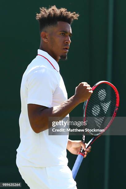 Michael Mmoh of The United States celebrates a point during his Men's Singles first round match against Gilles Muller of Luxembourg on day one of the...