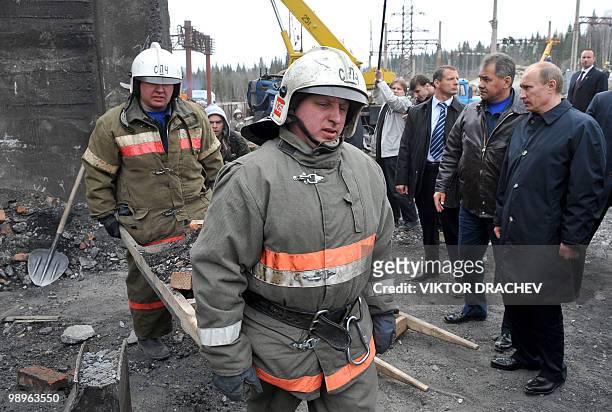 Russian Prime Minister Vladimir Putin visits the Raspadskaya mine in the city of Mezhdurechensk in the west Siberian region of Kemerovo on May 11,...