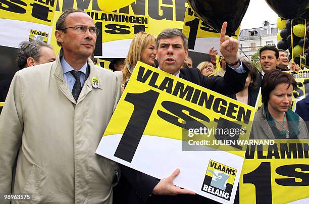 Vlaams Belang Party Chairman Bruno Valkeniers and member Filip Dewinter march during the launching of the Flemish far-right party Vlaams Belang's...