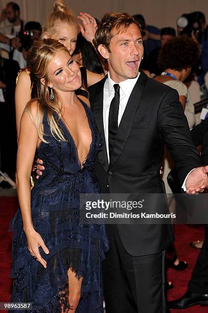 Actress Sienna Miller and actor Jude Law attend the Costume Institute Gala Benefit to celebrate the opening of the "American Woman: Fashioning a...