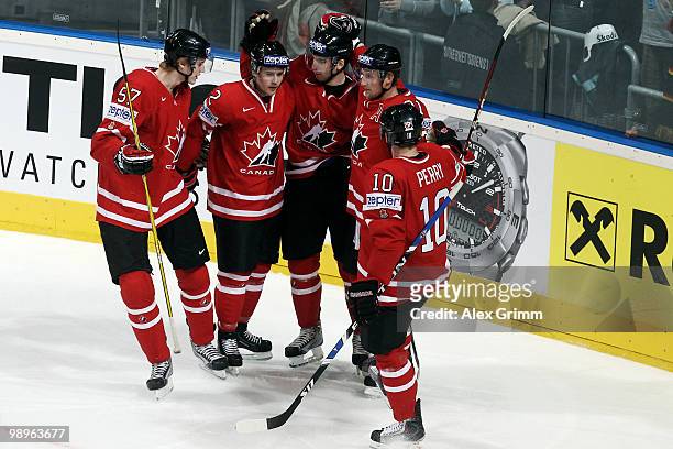 John Tavares of Canada celebrates his team's first goal with team mates Tyler Myers, Kris Russell, Steve Stamkos and Corey Perry during the IIHF...