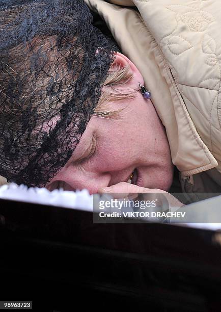 Relative mourns by the coffin of Fedor Akintiyev, a miner killed at the Raspadskaya mine, during a funeral ceremony in the city of Mezhdurechensk in...