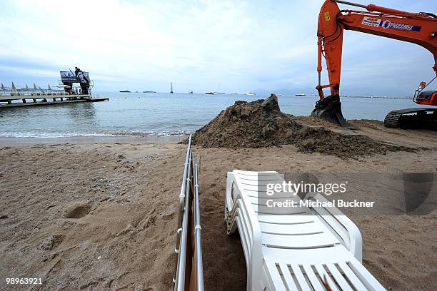 Construction crews replace sand washed away by recent storms at Carlton Beach along the Croisette prior to the annual film festival on May 11, 2010...