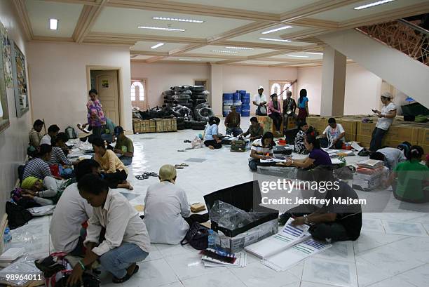 Board of Election inspectors work at the old provincial capitol of Maguindanao as vote counting continues to try to determine the next President of...