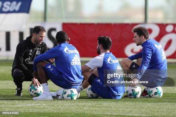 Schalke's coach Domenico Tedesco speaks with Bernard Tekpetey, Pablo Insua and Leon Goretzka during the training session of the German Bundesliga...