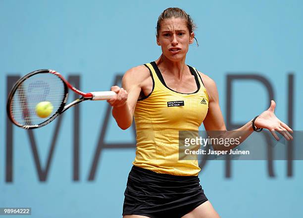 Andrea Petkovic of Germany plays a ball to Flavia Pennetta of Italy in their second round match during the Mutua Madrilena Madrid Open tennis...